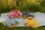 Baby sandals on picnic blanket